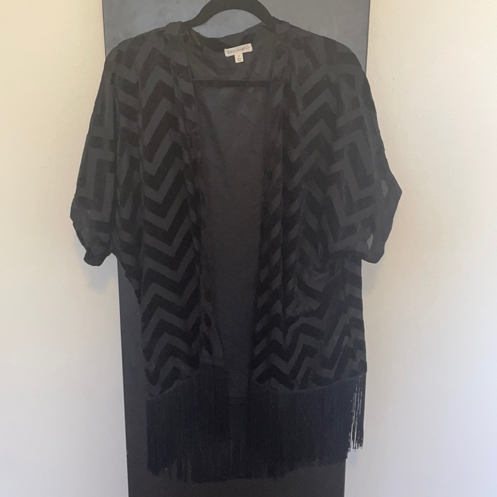 Black chevron short sleeved cardigan with fringe on bottom